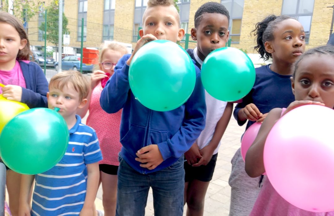 group of children with balloons