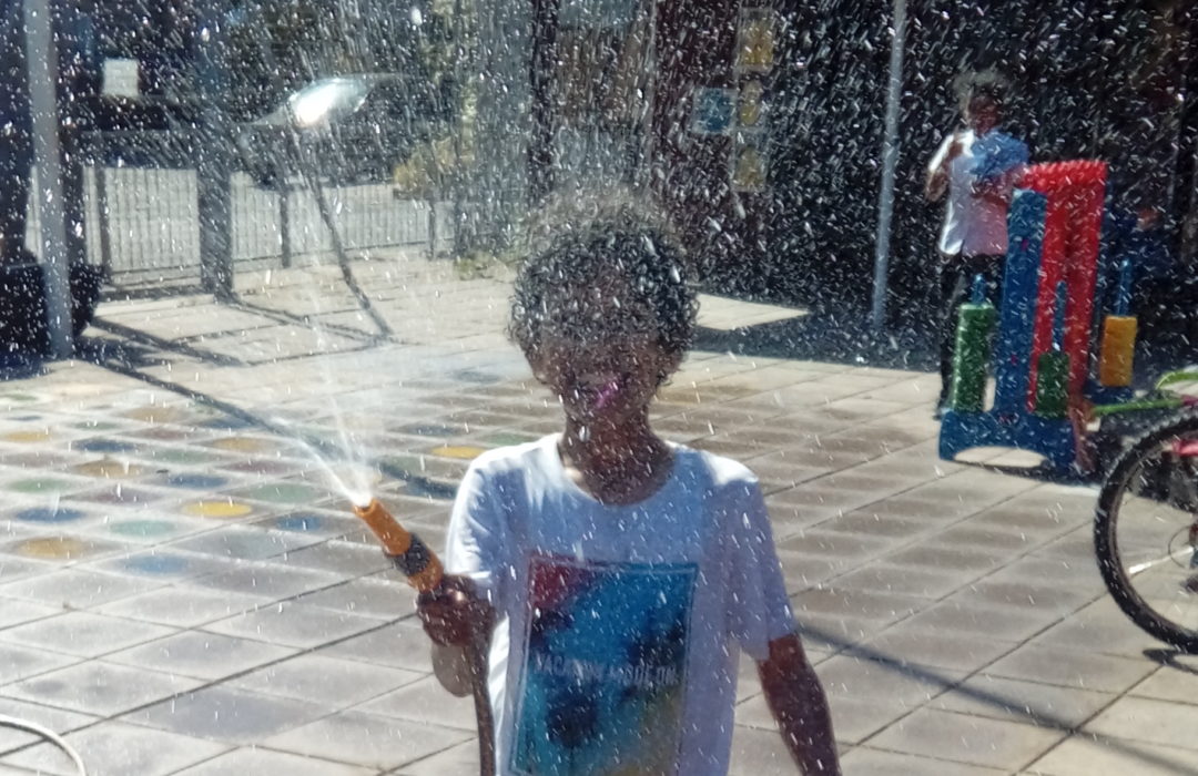 child with hose