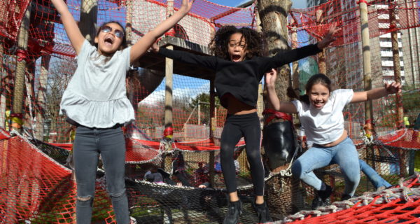 Children jumping on a net