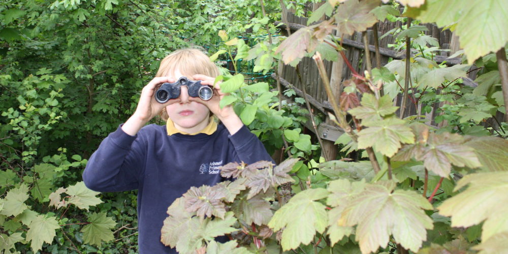 young person with binoculars